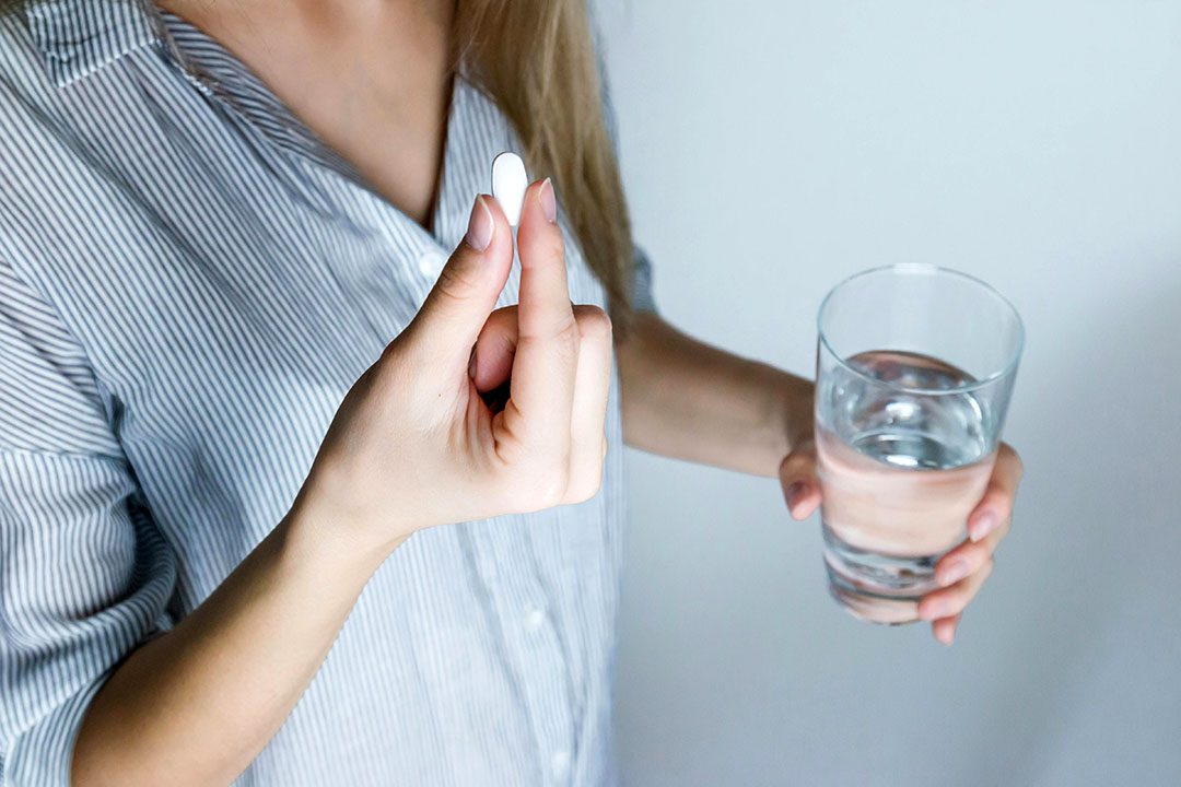 woman taking anxiety medication
