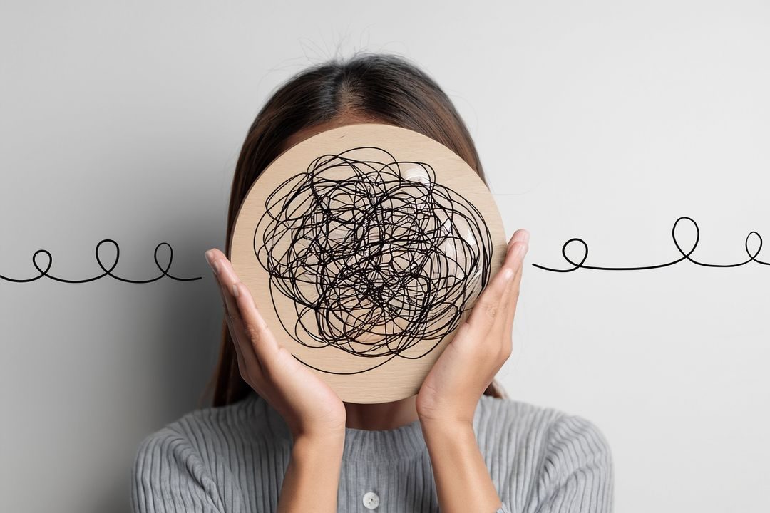 Person representing emotional overwhelm and anxiety often addressed through trauma therapy